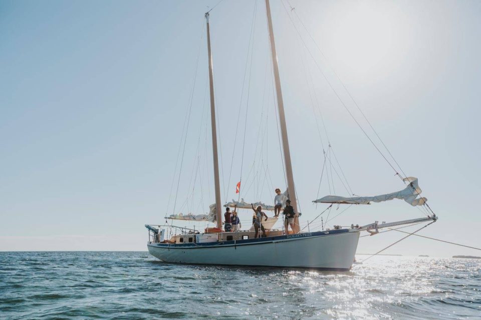 A group of people relax on a beautiful schooner sailing near Key West